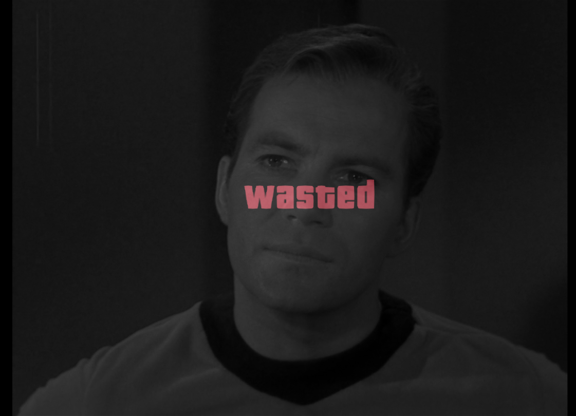 Kirk staring flatly ahead with a Grand Theft Auto-style 'wasted' overlay. 